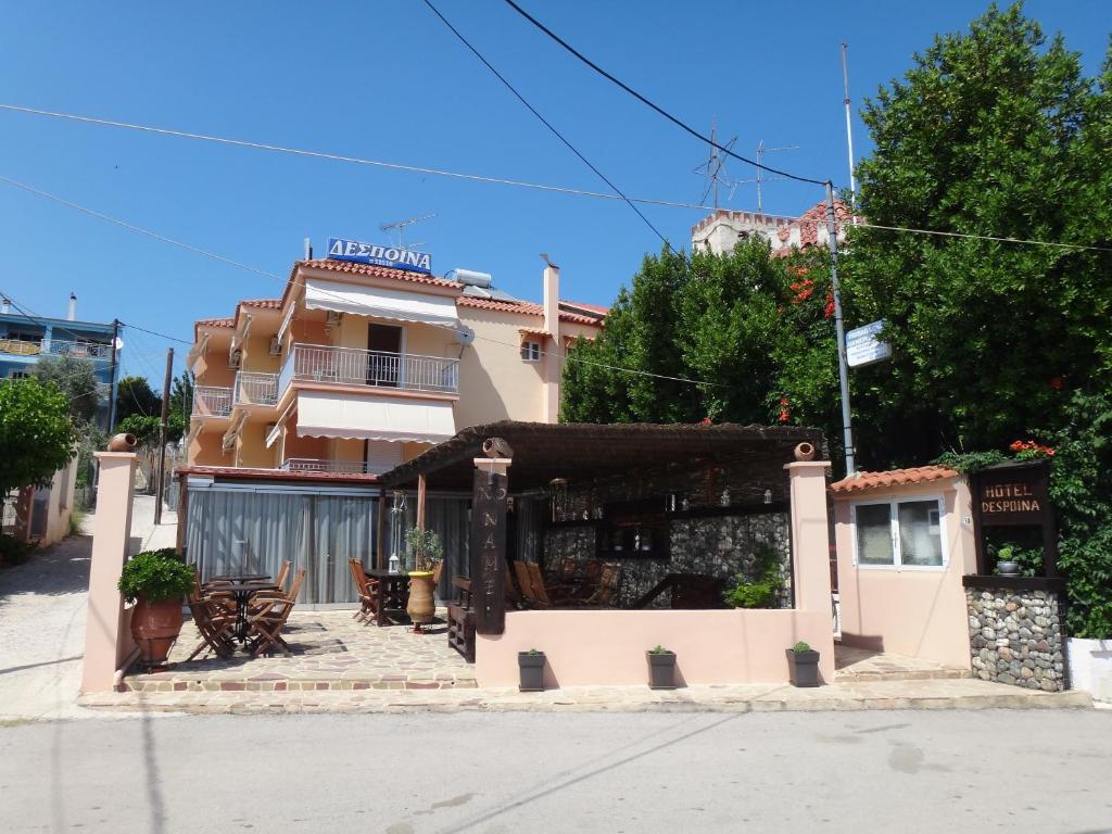 a building on the side of a street at Despoina Apartments in Edipsos