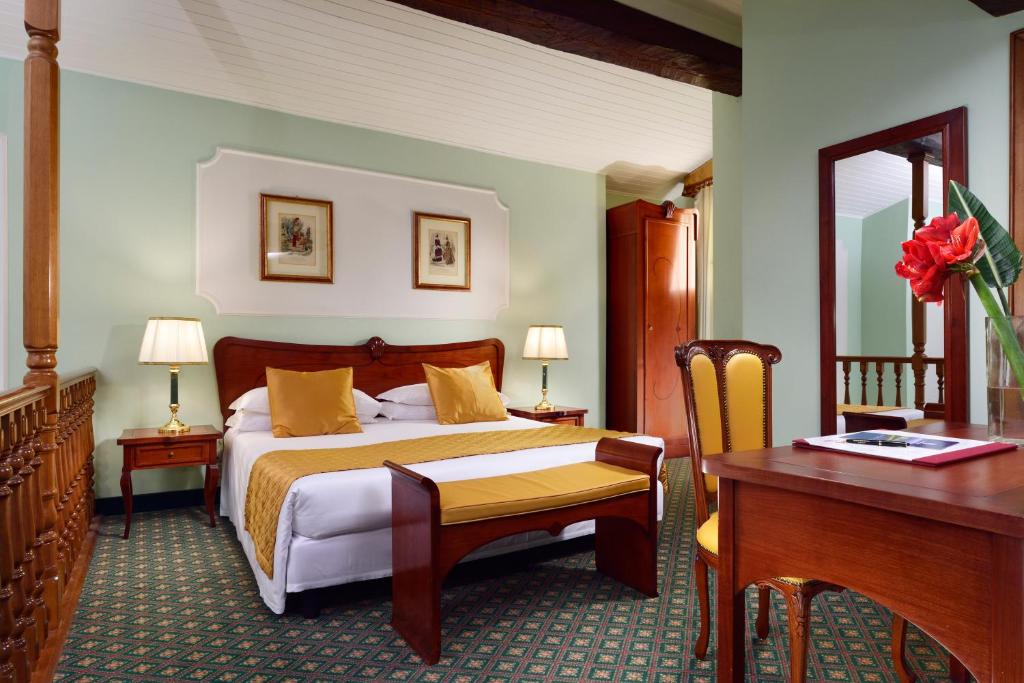Postel nebo postele na pokoji v ubytování Hotel Berchielli