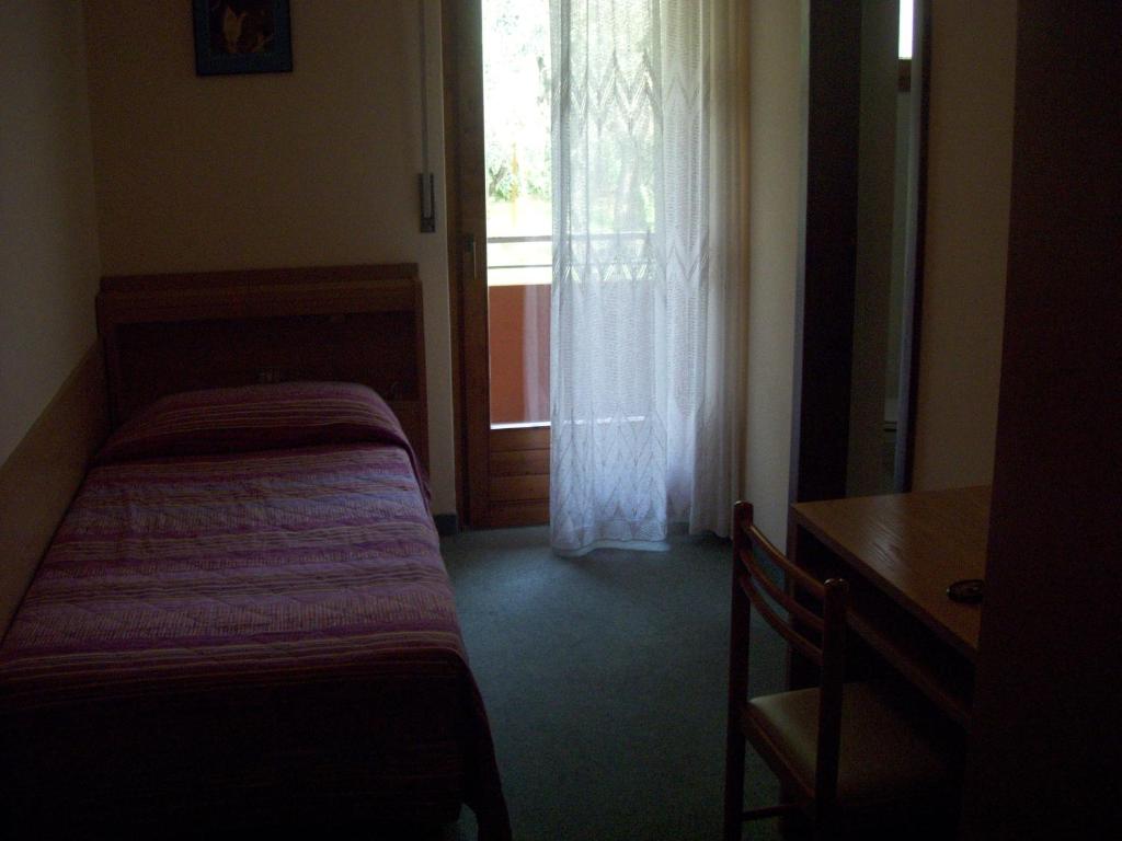 Postel nebo postele na pokoji v ubytování Garnì Casa Rabagno