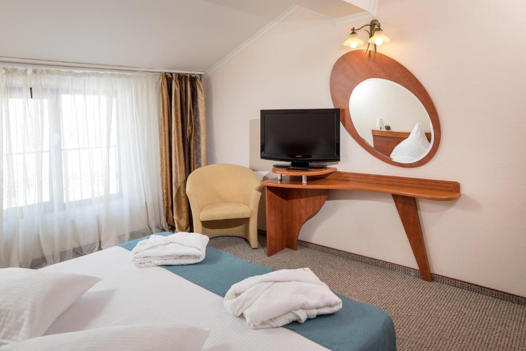 Postel nebo postele na pokoji v ubytování Hotel Rozmarin