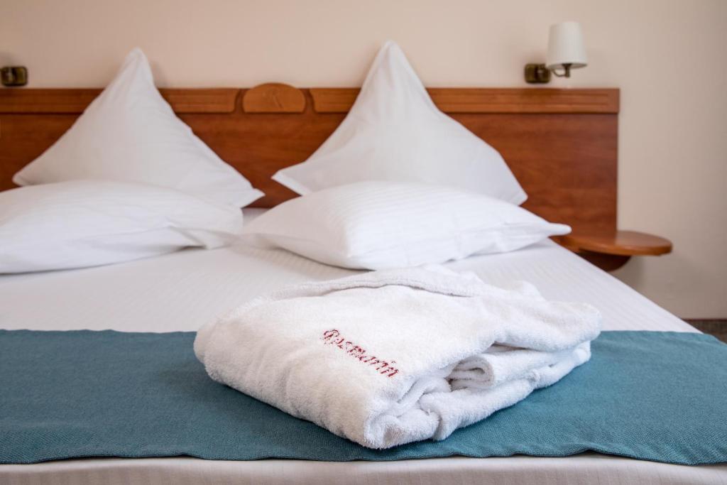 Postel nebo postele na pokoji v ubytování Hotel Rozmarin