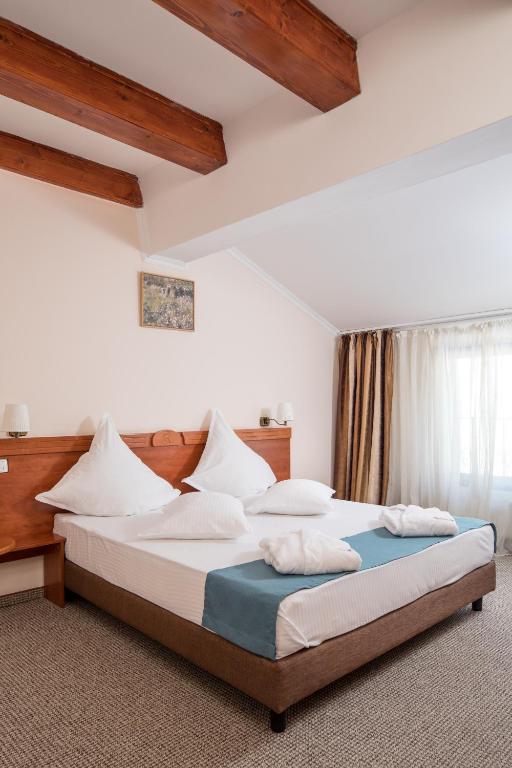 Postel nebo postele na pokoji v ubytování Hotel Rozmarin