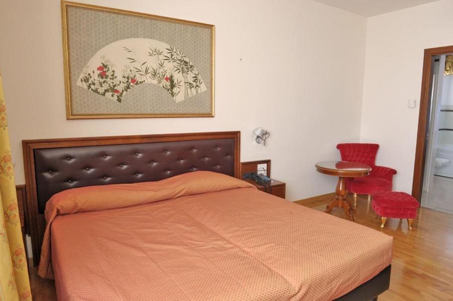 Postel nebo postele na pokoji v ubytování Hotel Svevo
