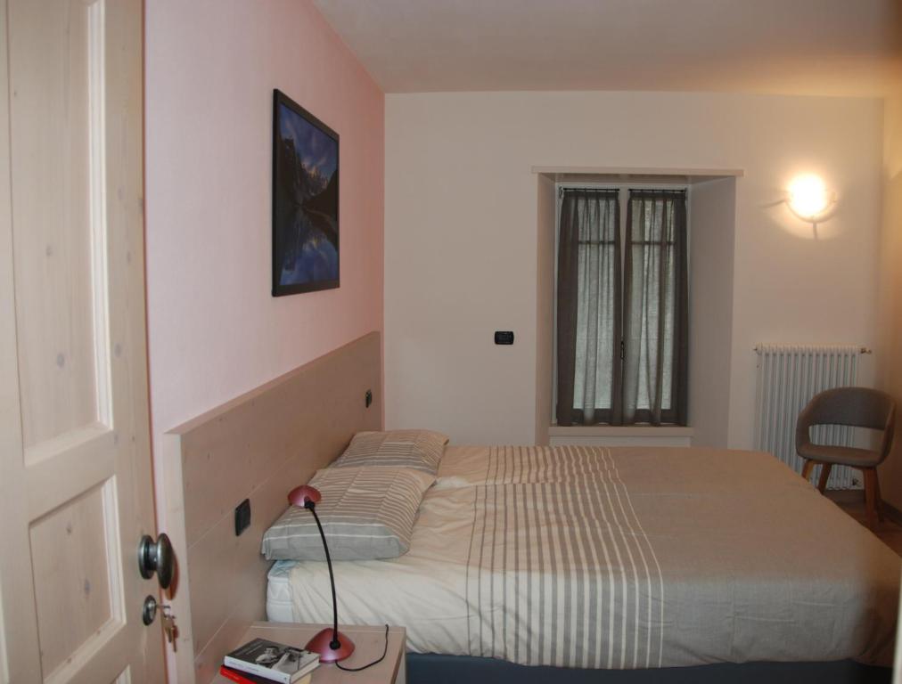 Postel nebo postele na pokoji v ubytování Marzia Rooms