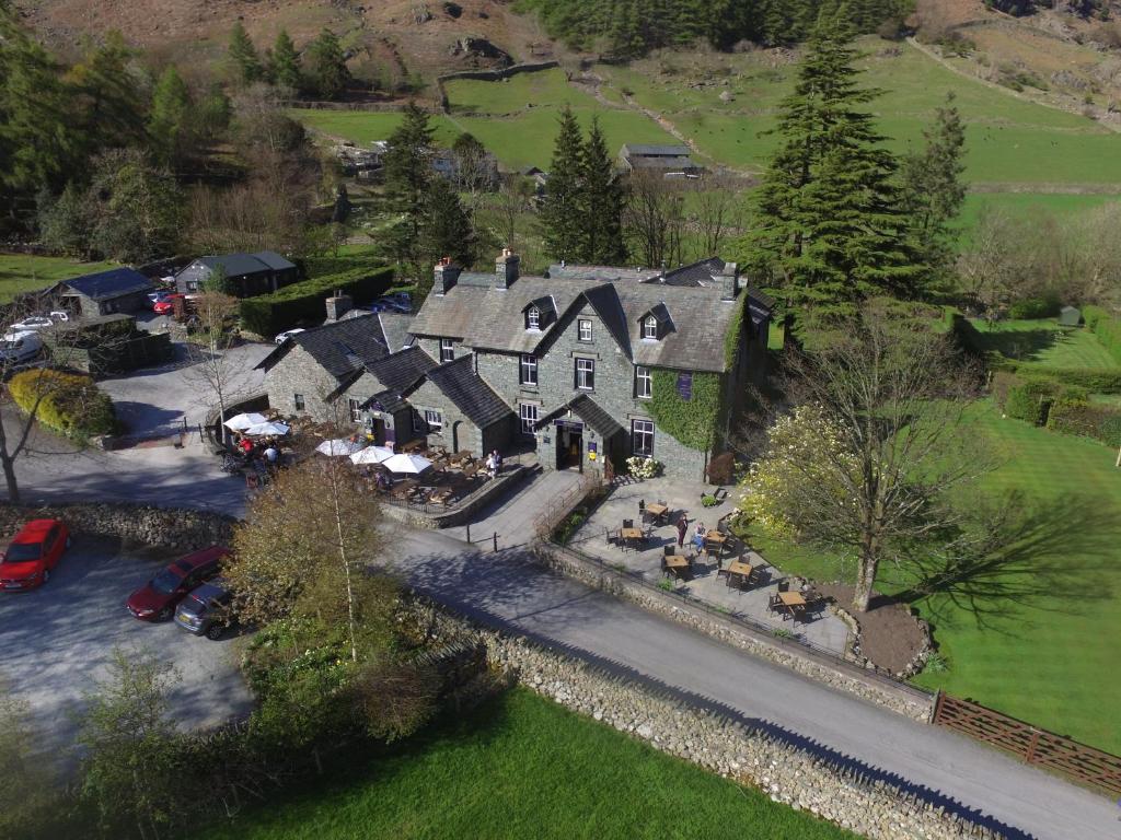 an aerial view of a large house with a yard at New Dungeon Ghyll Hotel in Great Langdale