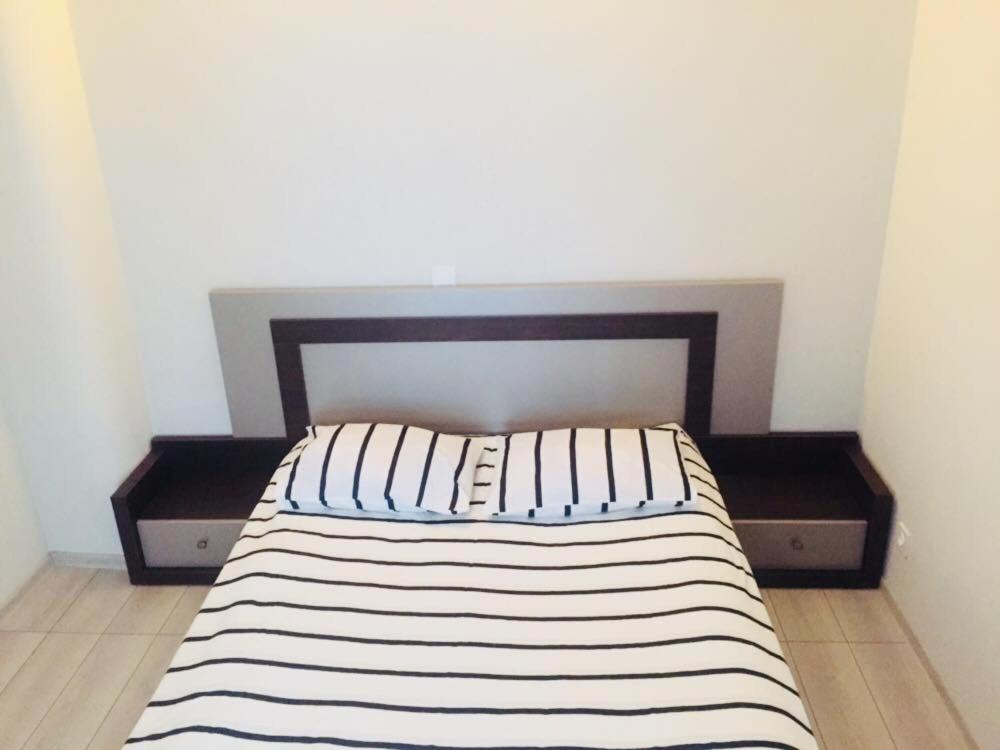 Postel nebo postele na pokoji v ubytování Apartment Soho Tabidze