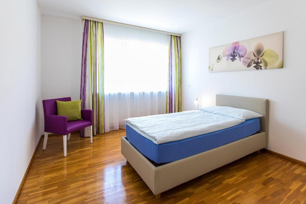 Postel nebo postele na pokoji v ubytování Tertianum Residenza Al Lido - Appartements & Restaurant