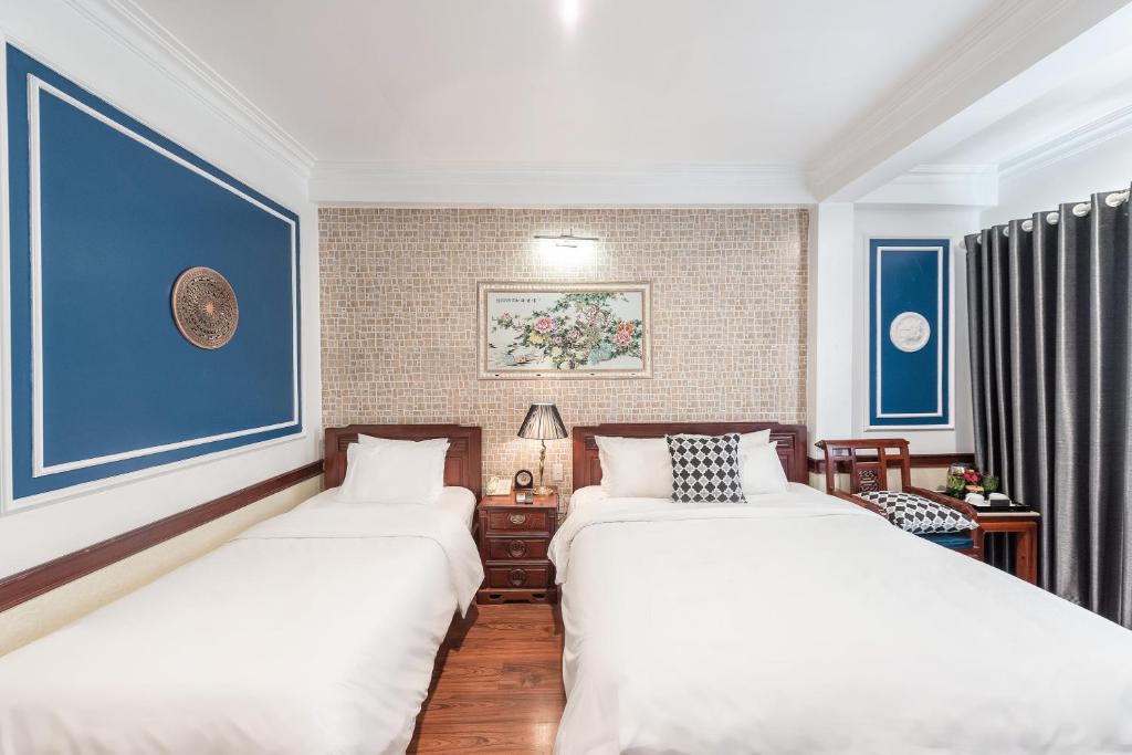 Postel nebo postele na pokoji v ubytování Prince II Hotel