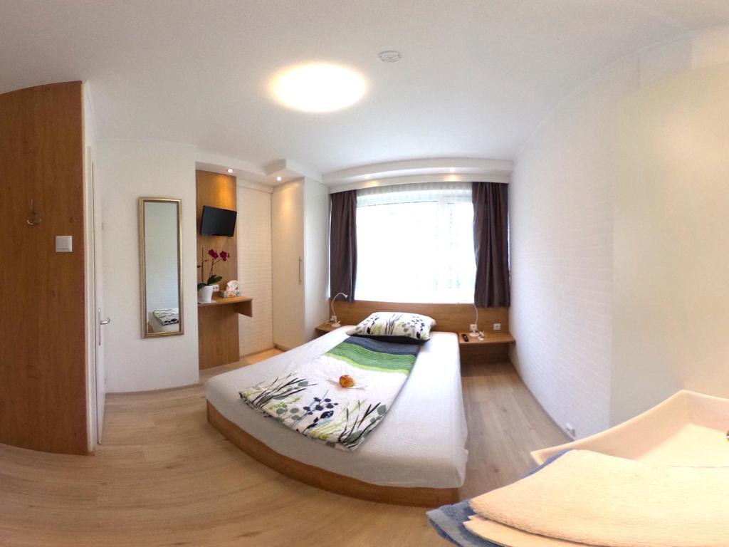 Postel nebo postele na pokoji v ubytování Haus Charlie