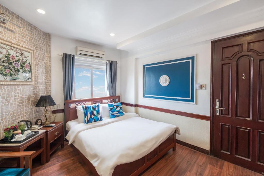 Postel nebo postele na pokoji v ubytování Prince II Hotel