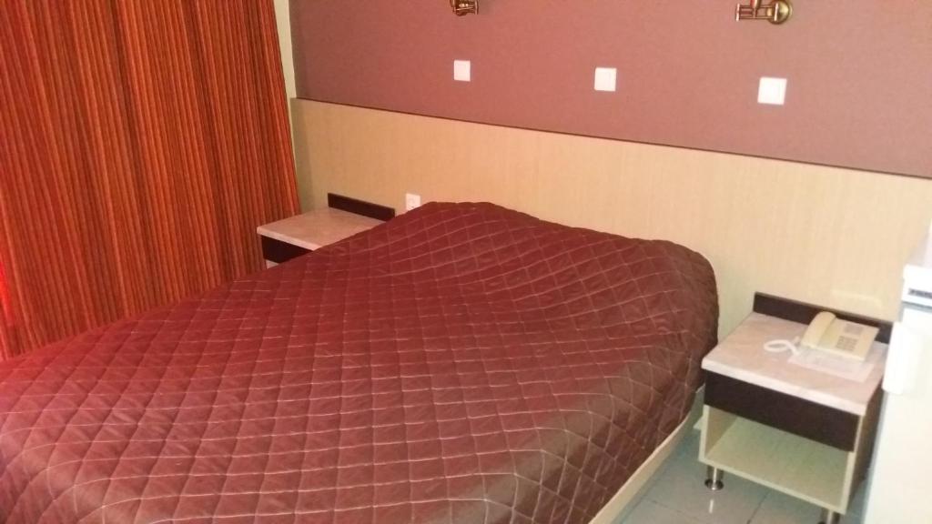 Postel nebo postele na pokoji v ubytování Dimitris Paritsa Hotel