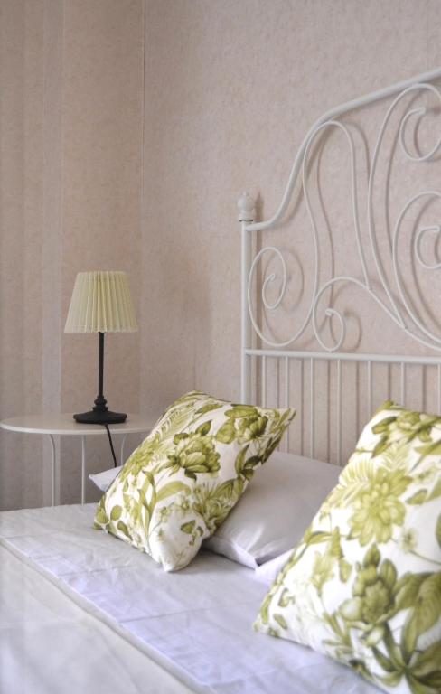 Łóżko lub łóżka w pokoju w obiekcie Casa Jolanda B&B