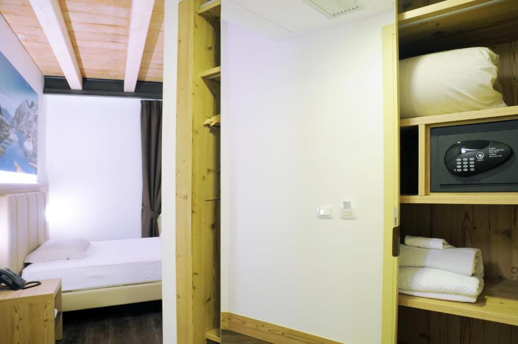 A bed or beds in a room at TOURING HOTEL & SPA