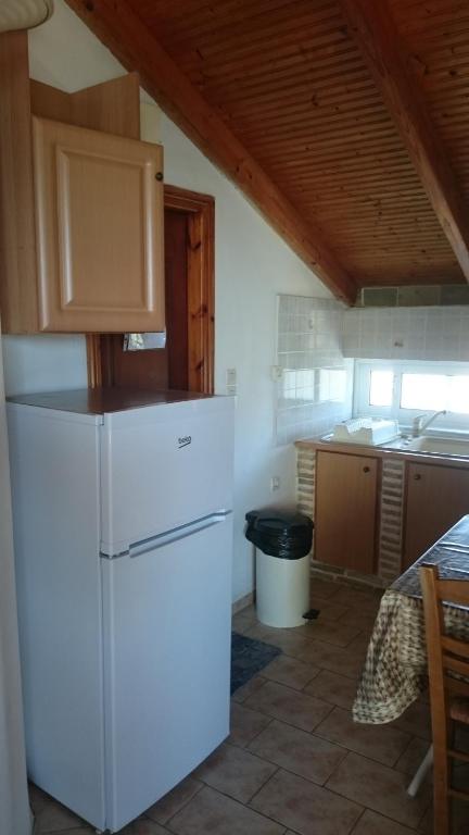 A cozinha ou kitchenette de Dakis Studios