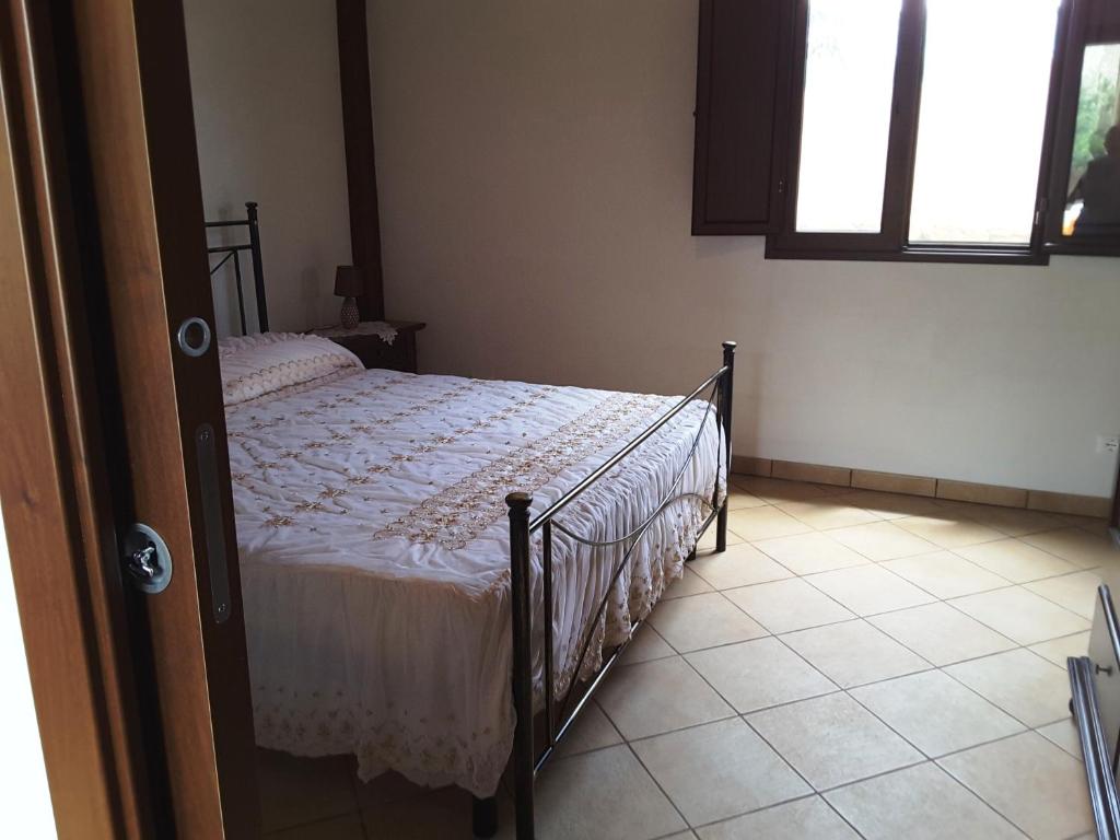 Postel nebo postele na pokoji v ubytování Il Rustico di Pino