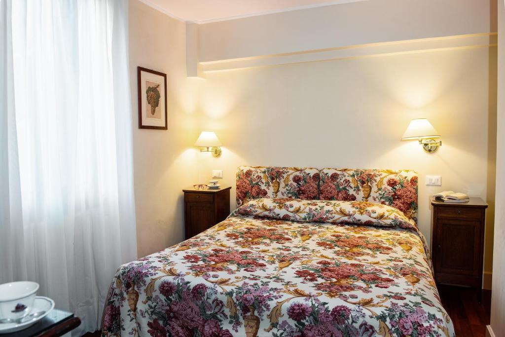 Postel nebo postele na pokoji v ubytování Hotel Agli Alboretti