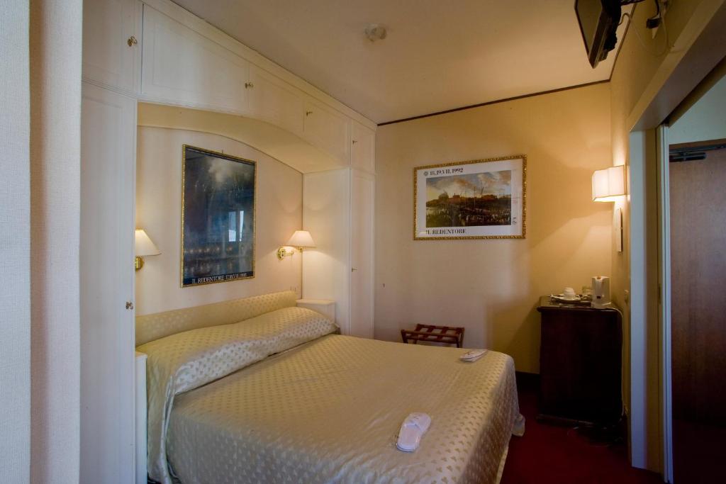 Postel nebo postele na pokoji v ubytování Hotel Agli Alboretti