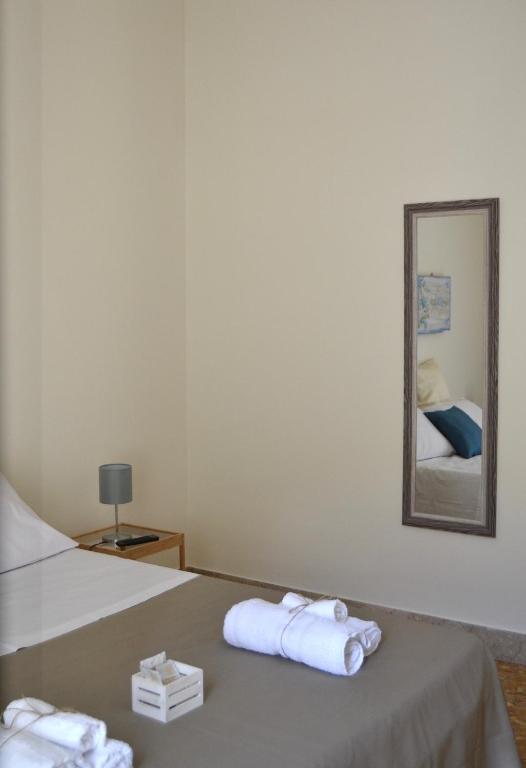 Łóżko lub łóżka w pokoju w obiekcie Casa Jolanda B&B