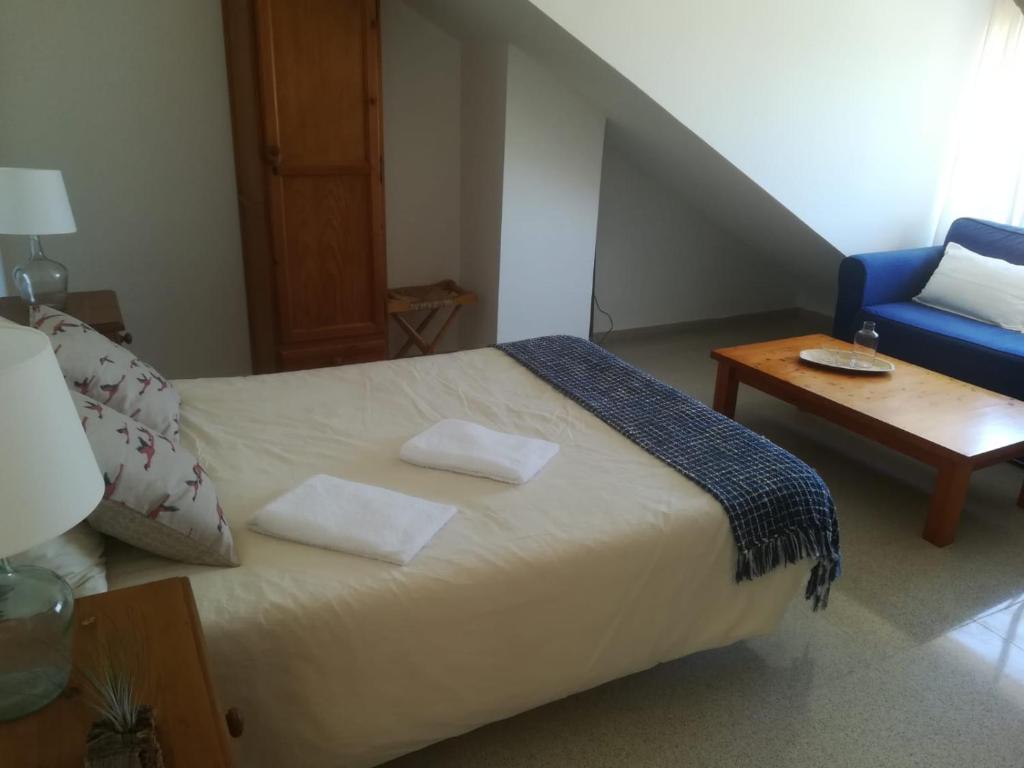 Postel nebo postele na pokoji v ubytování Casa Algaida