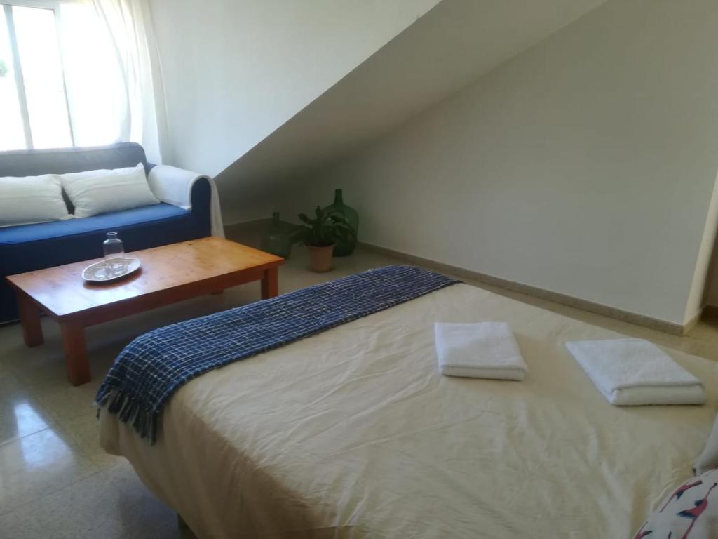 Postel nebo postele na pokoji v ubytování Casa Algaida