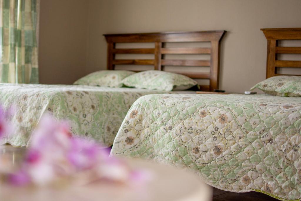 Postel nebo postele na pokoji v ubytování Hotel Pacuare