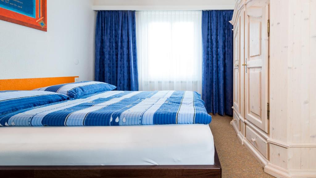 Postel nebo postele na pokoji v ubytování Haus Aristella