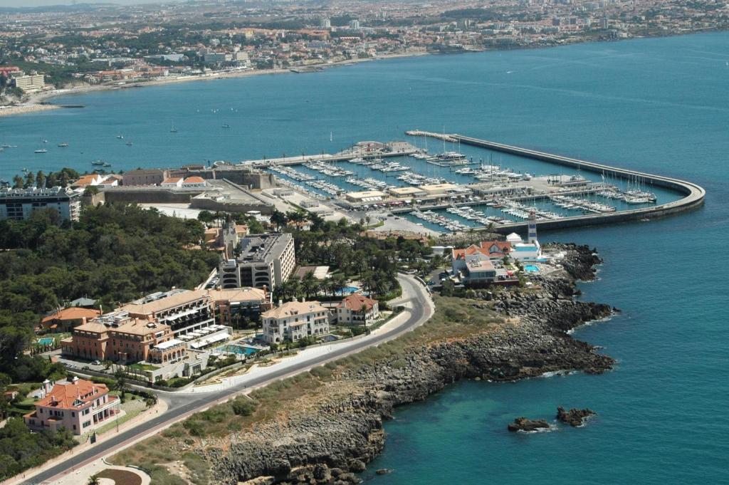 an aerial view of a harbor with a marina at Grande Real Villa Itália Hotel & Spa in Cascais