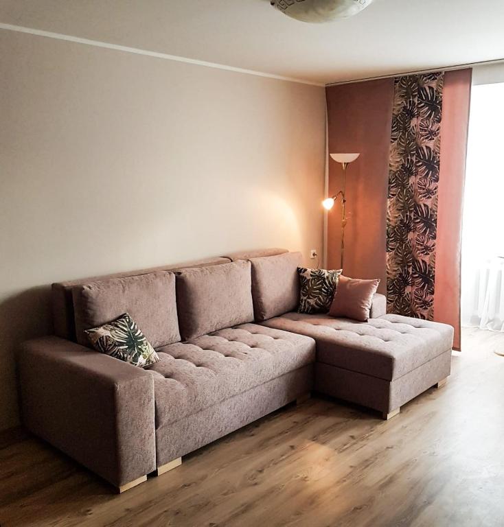 a living room with a couch in a room at B-Est Lilleküla Apartment in Tallinn