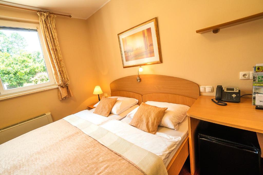Postel nebo postele na pokoji v ubytování Guest House Pri Gondoli