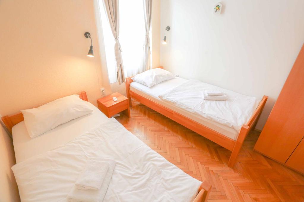 Letto o letti in una camera di Pigeon Square Rooms