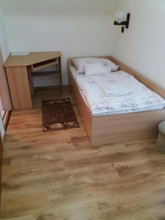 Postel nebo postele na pokoji v ubytování Ádám Vendégház