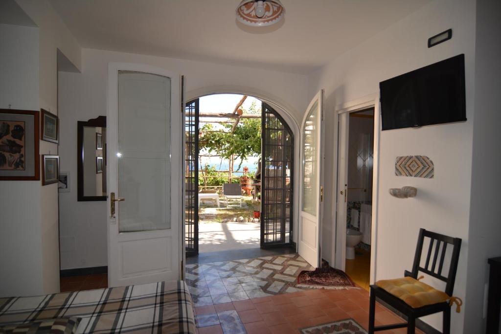 a hallway with an archway leading into a house at Bella Baia Relais in Maiori