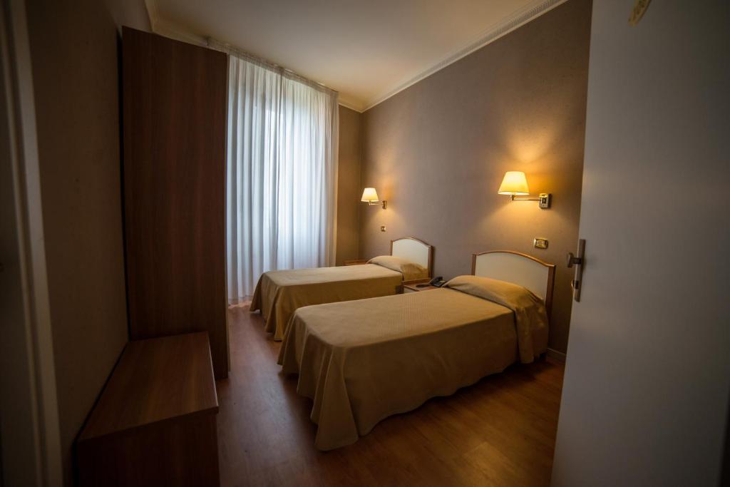 Postel nebo postele na pokoji v ubytování Hotel Relais Filonardi