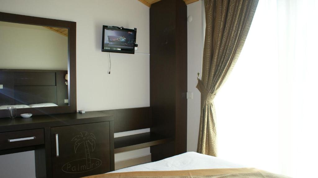 Vuode tai vuoteita majoituspaikassa Palmira Hotel