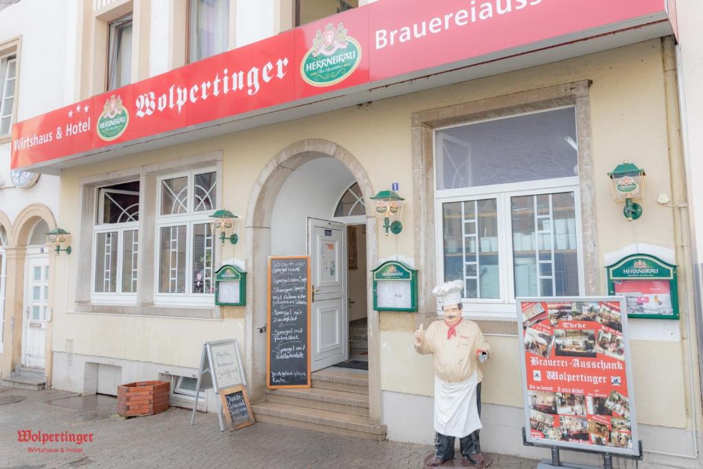a statue of a woman standing outside of a restaurant at Wirtshaus Wolpertinger in Bad Kreuznach