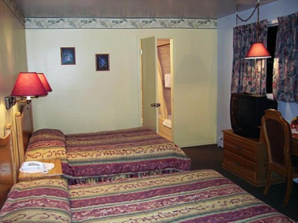 Letto o letti in una camera di Auberge Mountain View Inn