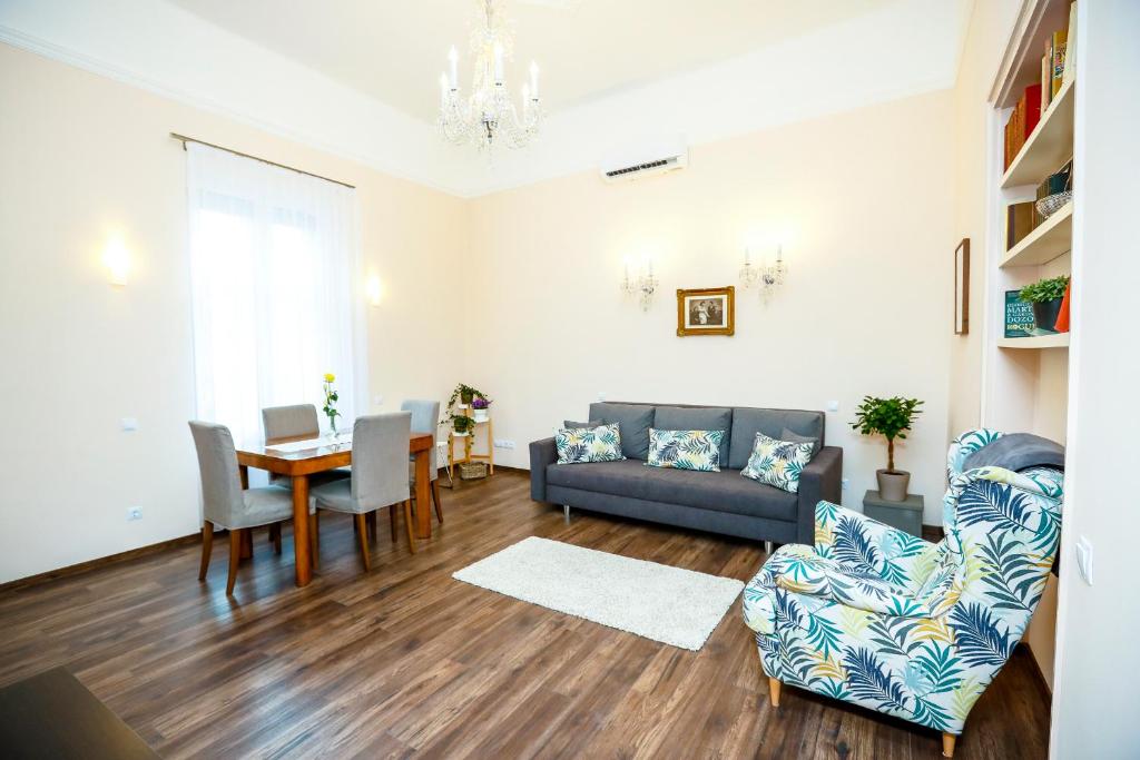 a living room with a couch and a table at D8 Design Apartment & Studio in Eger