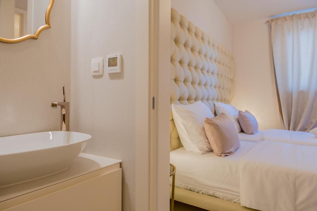 Postel nebo postele na pokoji v ubytování LevelUp Apartment Split