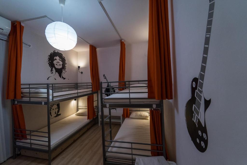 Postel nebo postele na pokoji v ubytování Pijama Hostel