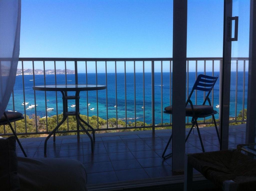 a room with a view of the ocean from a balcony at Panorama in Calpe