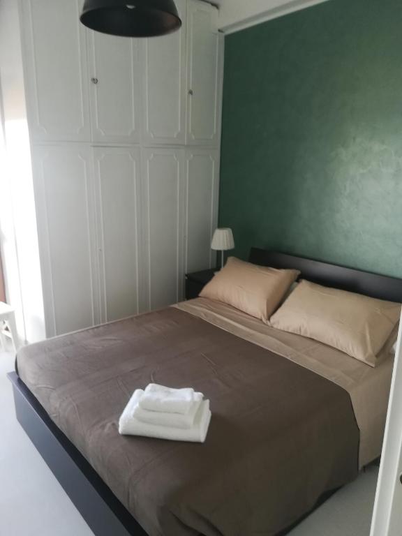 Postel nebo postele na pokoji v ubytování Guest House Domus Cicerone