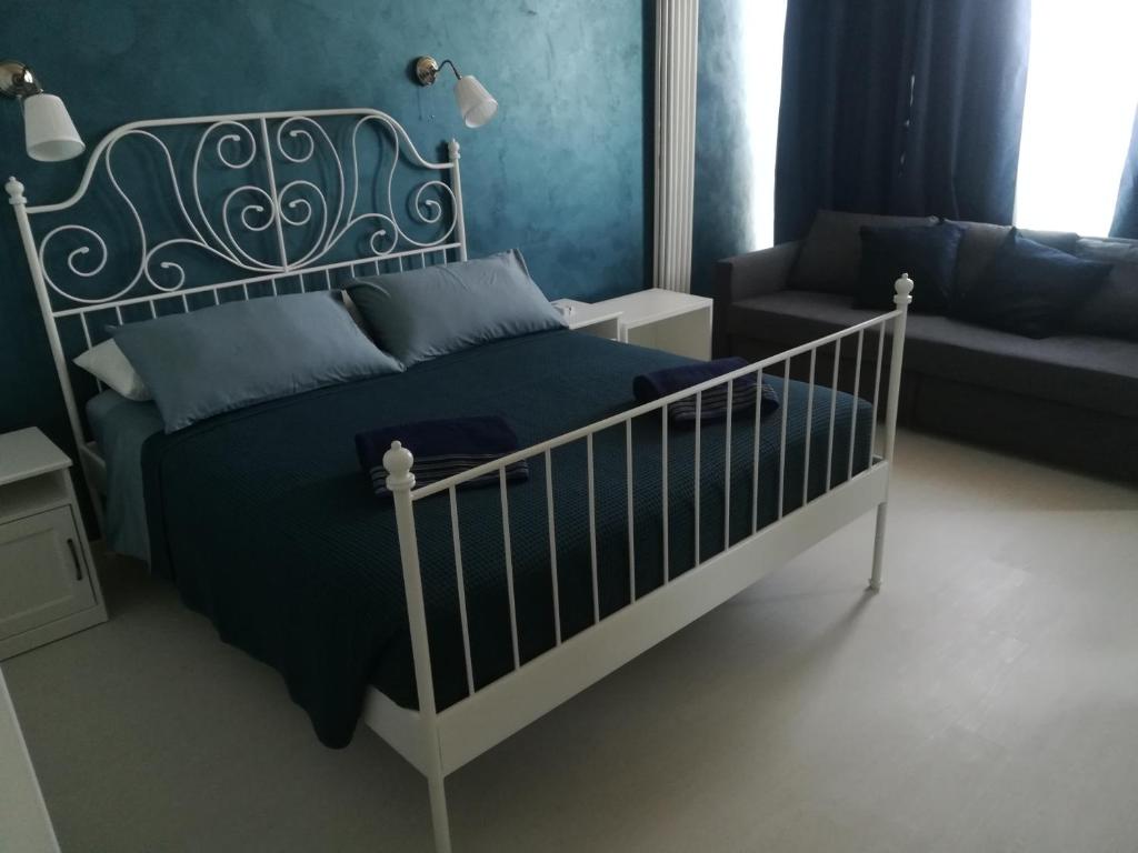 Postel nebo postele na pokoji v ubytování Guest House Domus Cicerone