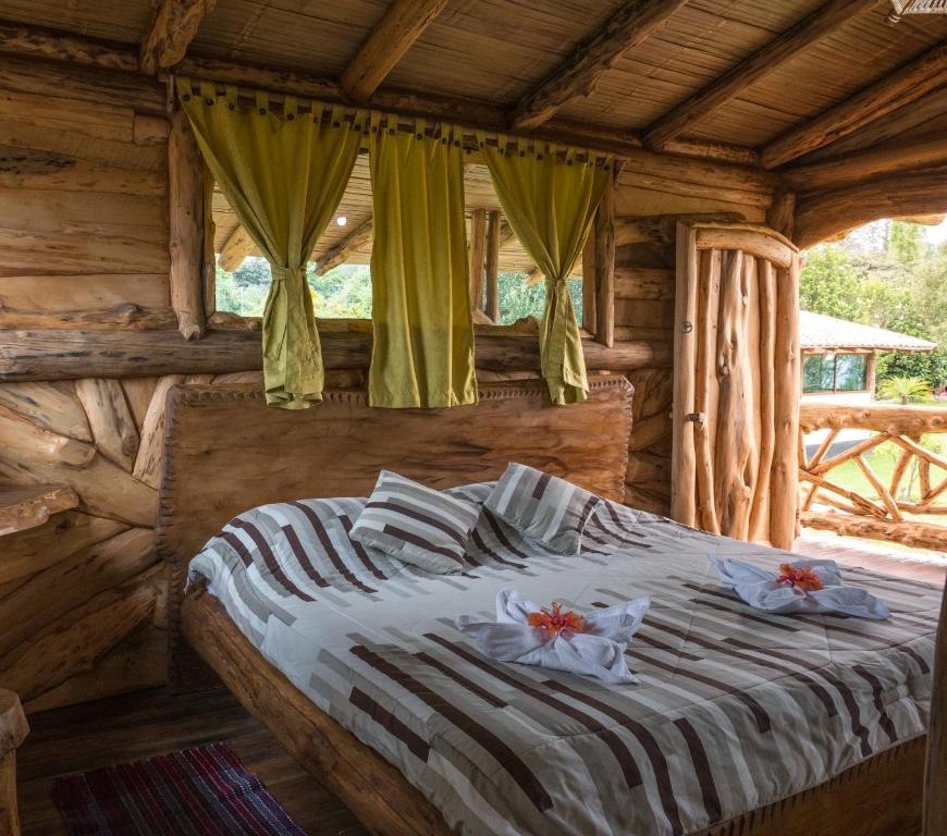 Postel nebo postele na pokoji v ubytování Zaysant Ecolodge