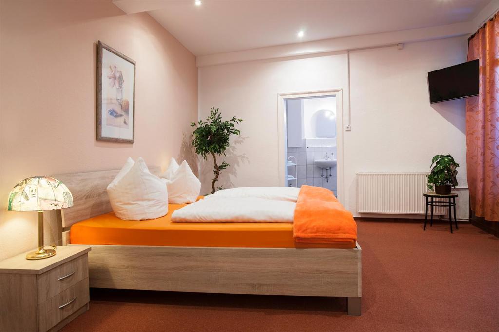 Letto o letti in una camera di Hotel Weltrich