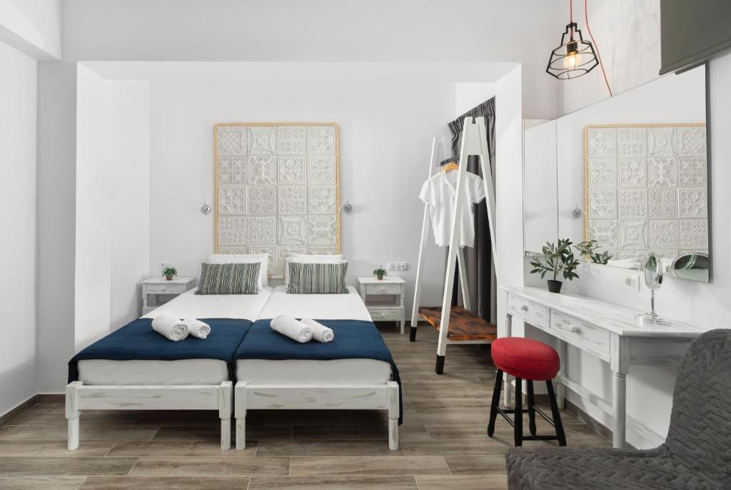 Postel nebo postele na pokoji v ubytování Pefkos View Suites & Maisonette