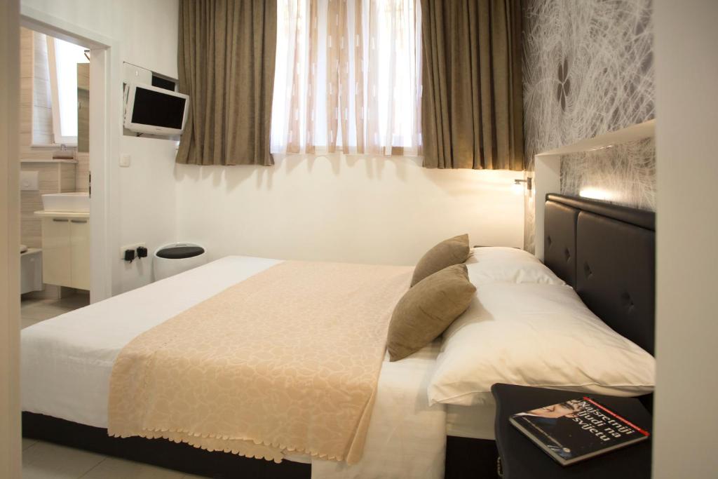Postel nebo postele na pokoji v ubytování Apartment & Room Split Lea