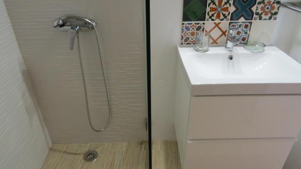 a bathroom with a shower and a sink at Casa Clara in Odeceixe