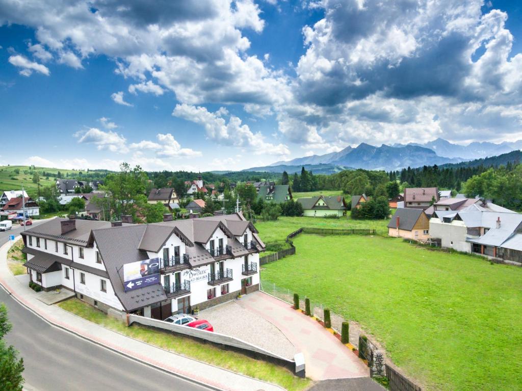 an aerial view of a town with mountains in the background at Dworek Nad Białką in Czarna Góra