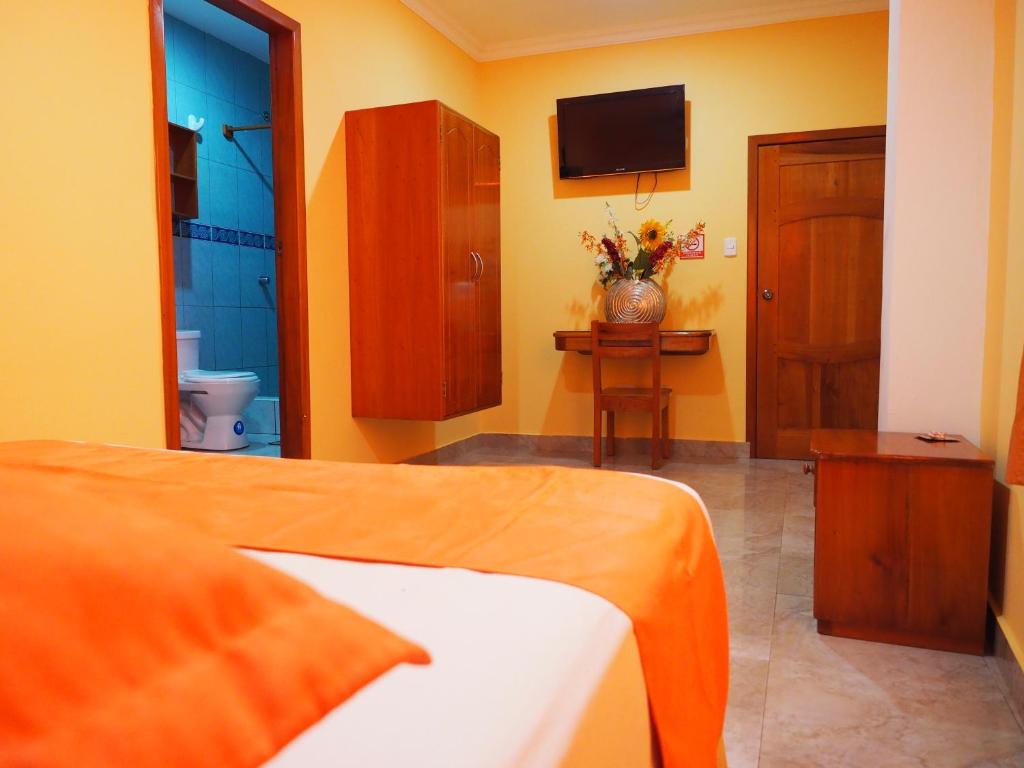 Postel nebo postele na pokoji v ubytování Hostal España