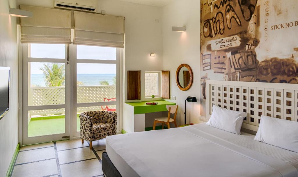 Postel nebo postele na pokoji v ubytování Hotel J Negombo